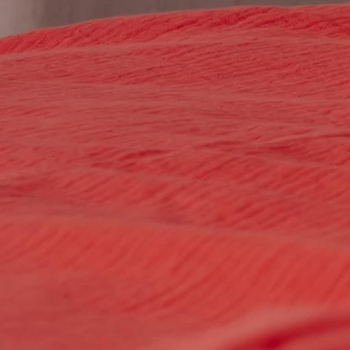 Musselin Bettwäsche 135x200 cm koralrot – Nahaufnahme Musselin Textur, 100% Baumwolle