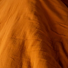 Musselin Bettwäsche 135x200 cm orange – Nahaufnahme Musselin Textur, 100% Baumwolle