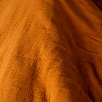 Musselin Bettwäsche 135x200 cm orange – Nahaufnahme Musselin Textur, 100% Baumwolle
